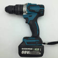 Black and yellow cordless impact drill with lithium battery on a workbench with drill bits.