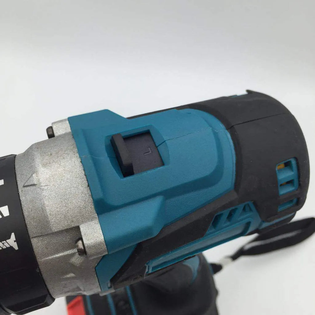 Black and yellow cordless impact drill with lithium battery on a workbench with drill bits.