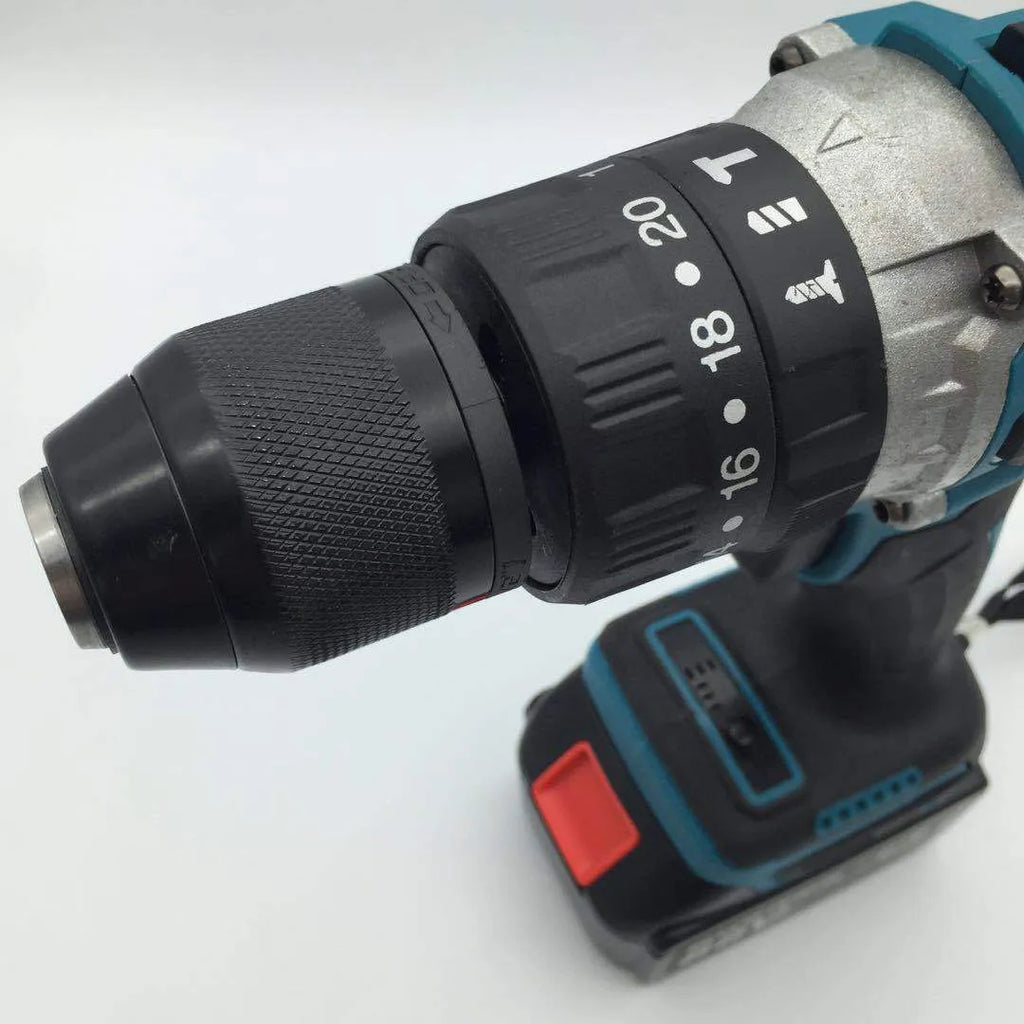 Black and yellow cordless impact drill with lithium battery on a workbench with drill bits.