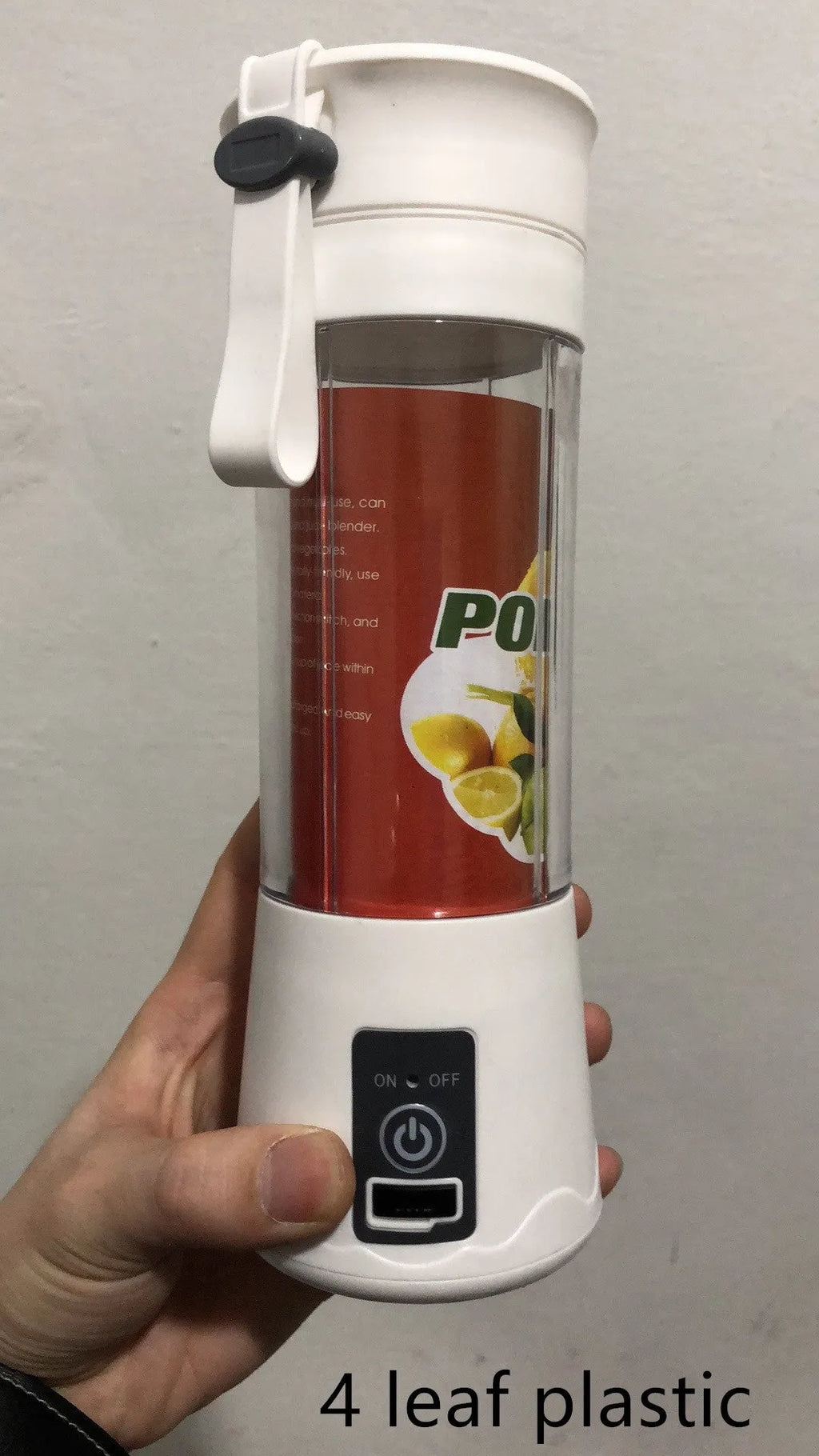 Mini USB-powered centrifugal fruit juicer in pink, with a 400ml plastic cup and stainless steel blade.