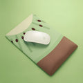 Silicone and cloth wrist support pad for keyboard and mouse use.
