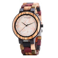 Round wooden watch with 40.5mm dial, quartz movement, and mineral glass mirror on a neutral background