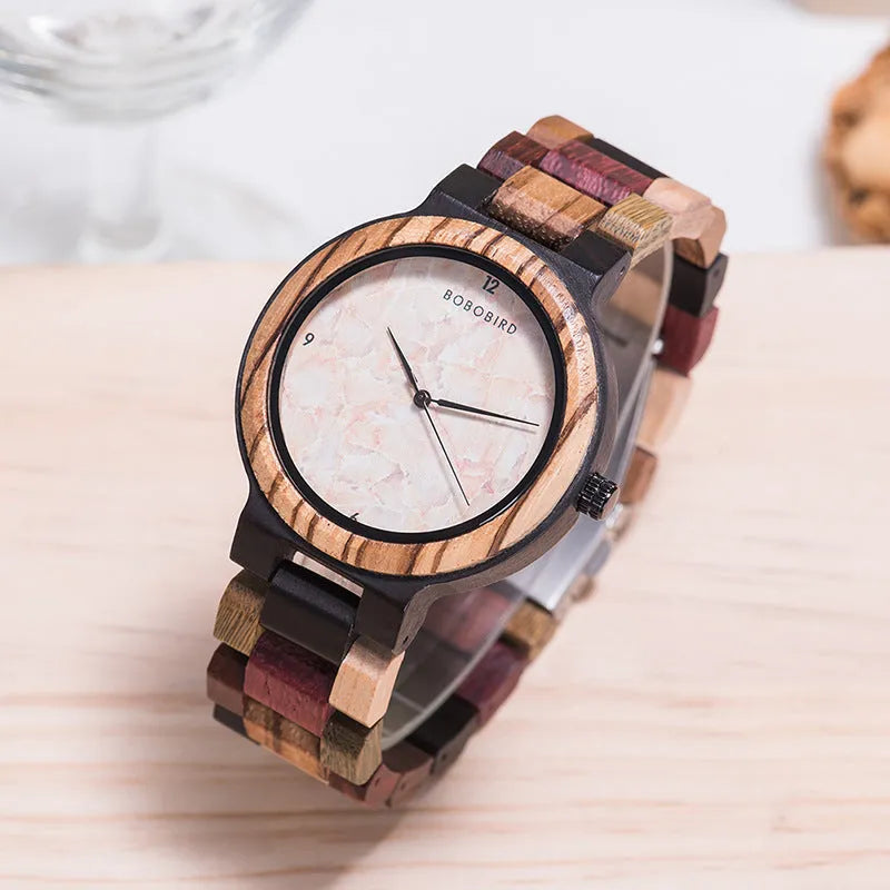 Round wooden watch with 40.5mm dial, quartz movement, and mineral glass mirror on a neutral background