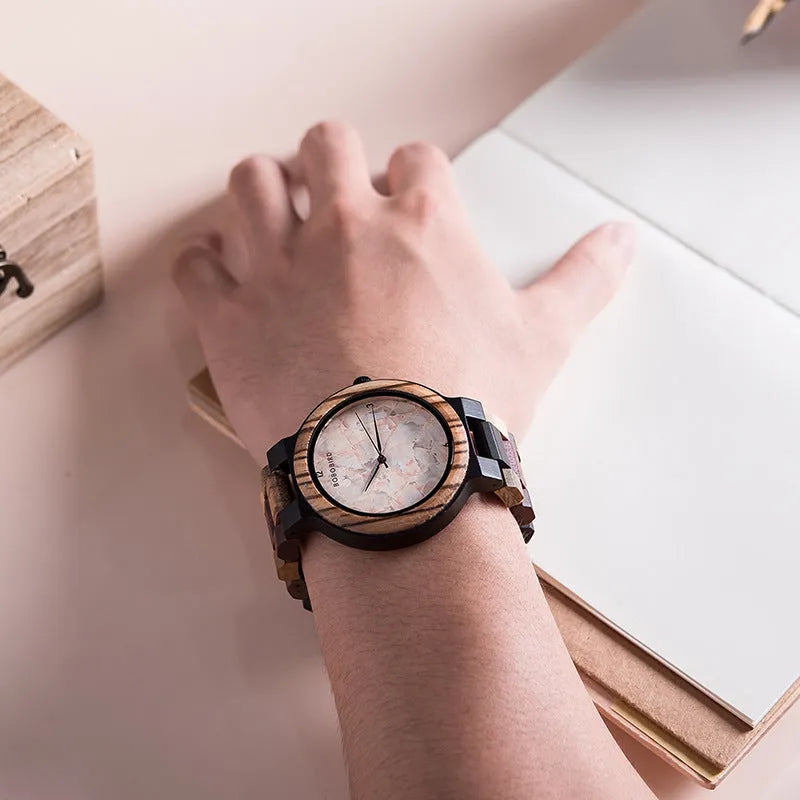Round wooden watch with 40.5mm dial, quartz movement, and mineral glass mirror on a neutral background
