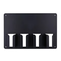 Black plastic wall-mounted rack holding four hair clippers with screws for assembly