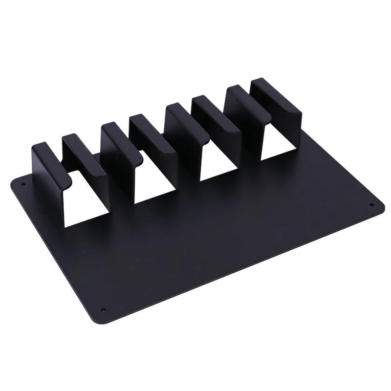 Black plastic wall-mounted rack holding four hair clippers with screws for assembly