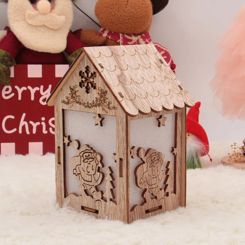 Set of three handmade wooden Christmas cottage ornaments: log bell, Santa house, and snowman house.