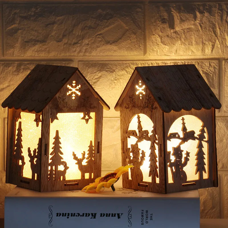 Set of three handmade wooden Christmas cottage ornaments: log bell, Santa house, and snowman house.