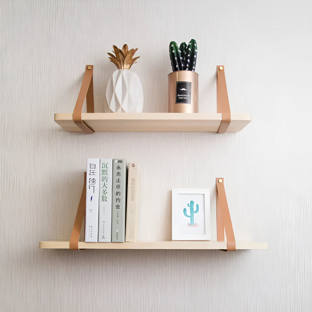 A narrow pine wood wall-mounted shelf unit for storing remote controls, books, and small items.