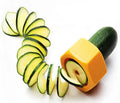 Yellow and green ABS plastic spiral vegetable cutter for slicing cucumbers.