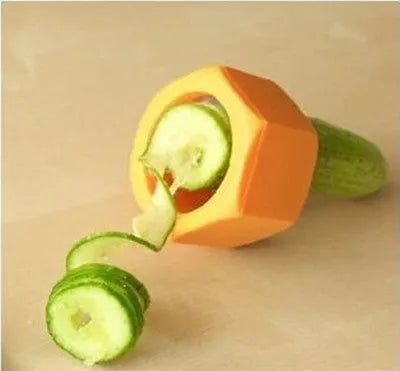 Yellow and green ABS plastic spiral vegetable cutter for slicing cucumbers.