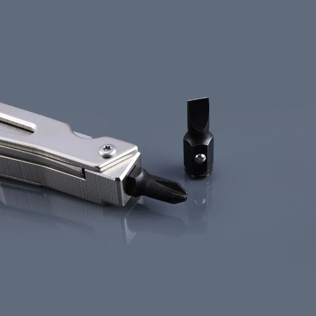 White stainless steel multi-function tool showing wrench, pliers, and blade components.