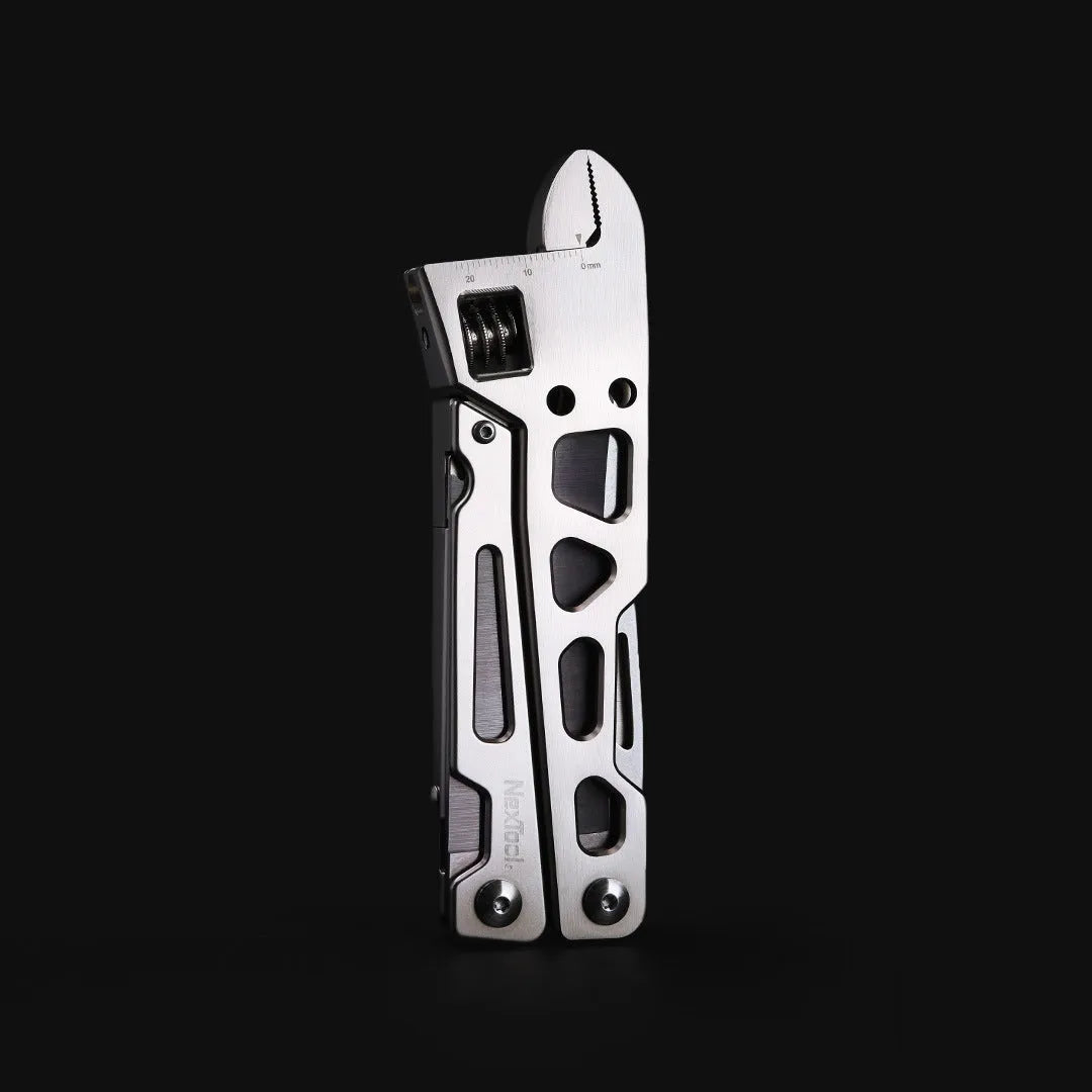 White stainless steel multi-function tool showing wrench, pliers, and blade components.