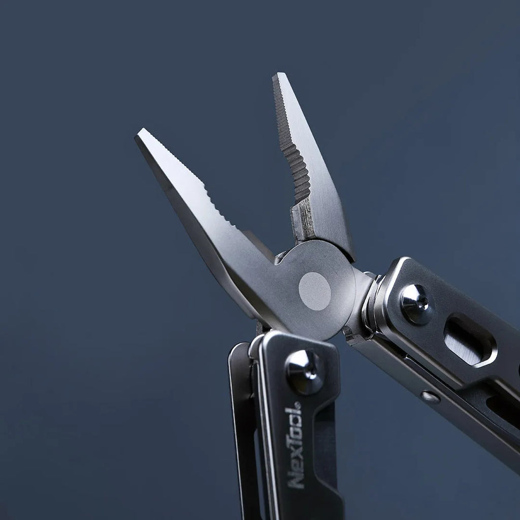 White stainless steel multi-function tool showing wrench, pliers, and blade components.