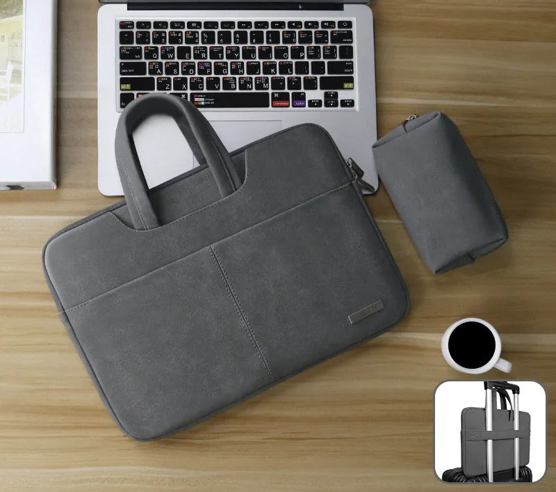 Blue PU leather laptop bag open, showing padded computer sleeve and internal organiser pockets.