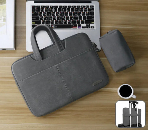 Blue PU leather laptop bag open, showing padded computer sleeve and internal organiser pockets.