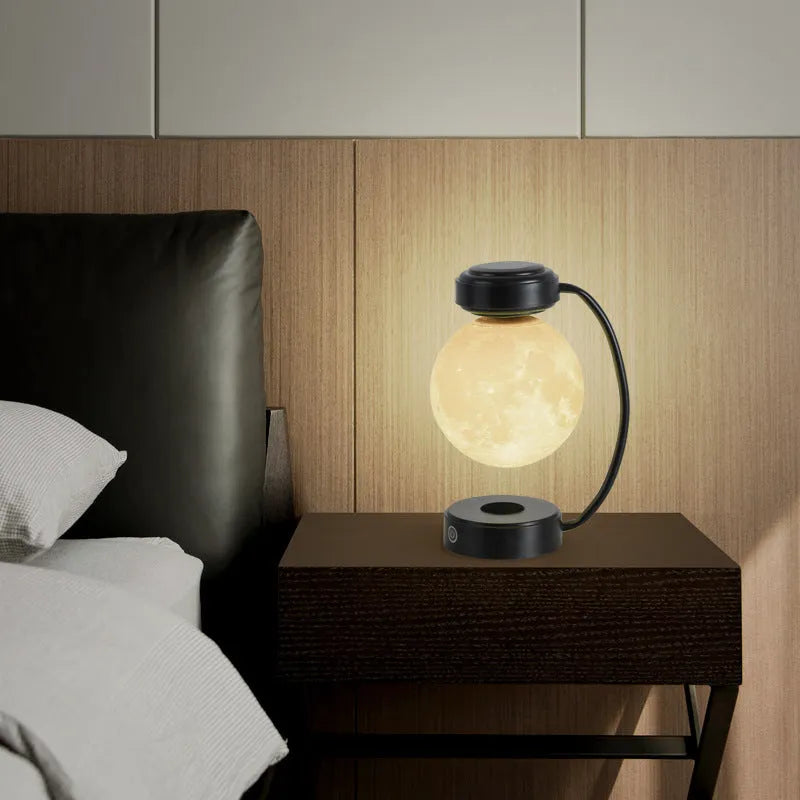 Magnetic levitation moon lamp floating above base with touch controls and 3-colour lighting