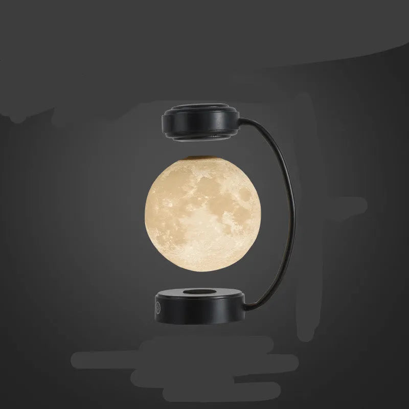 Magnetic levitation moon lamp floating above base with touch controls and 3-colour lighting