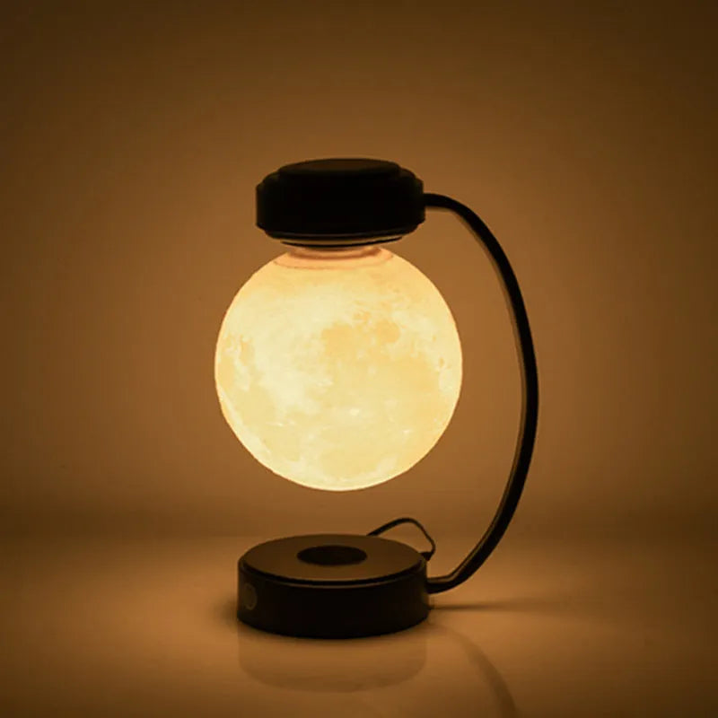 Magnetic levitation moon lamp floating above base with touch controls and 3-colour lighting