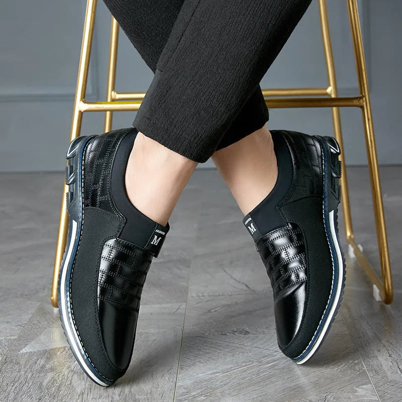 Men's black casual leather shoes with low upper height showing size label and sole detail
