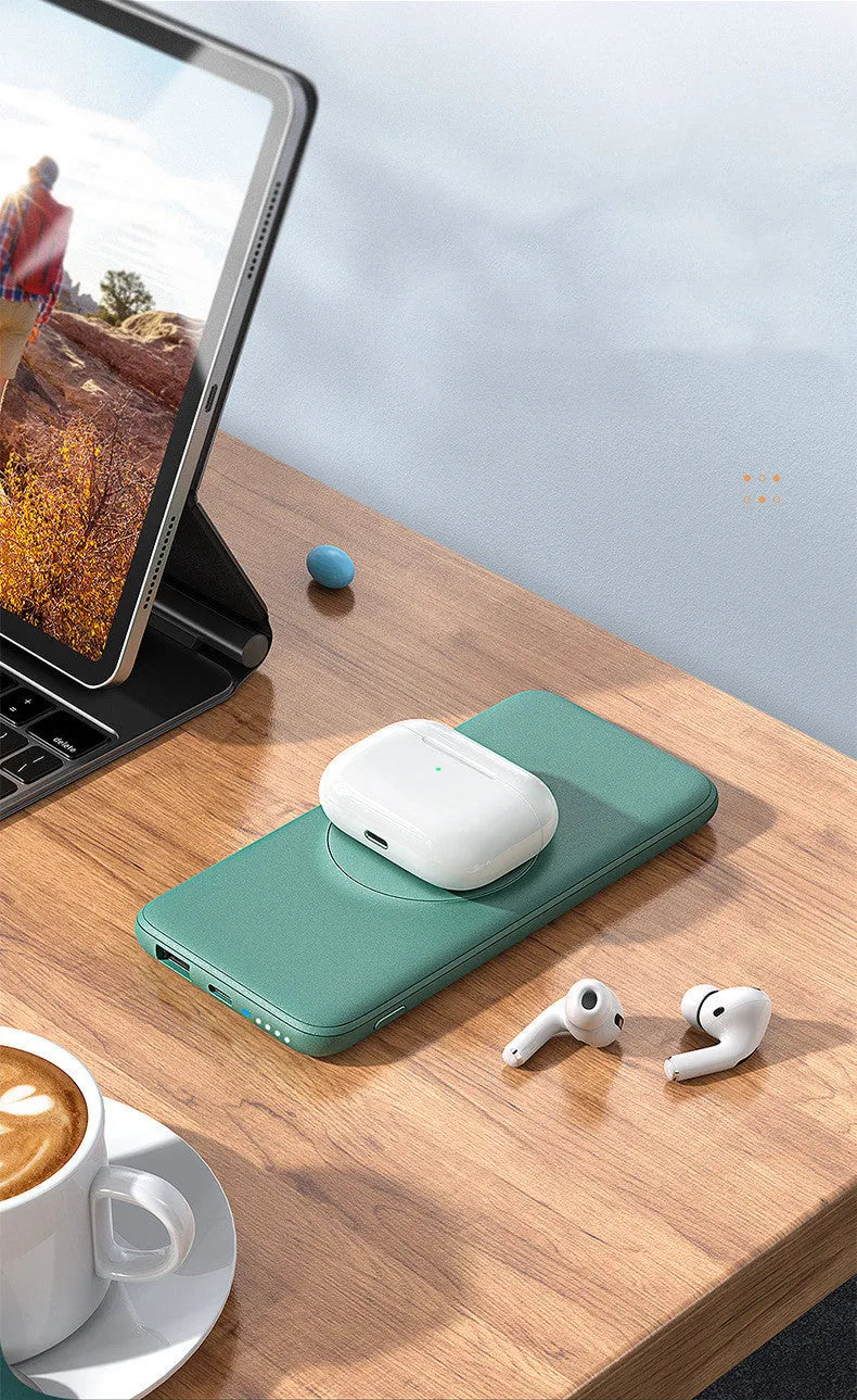 Maiduo mint green MagSafe magnetic wireless power bank with back clip, shown next to an iPhone.
