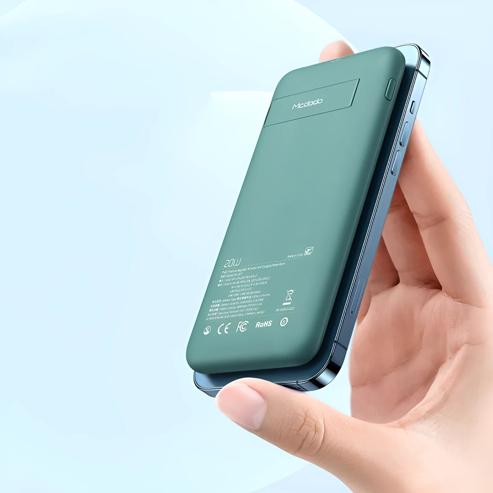 Maiduo mint green MagSafe magnetic wireless power bank with back clip, shown next to an iPhone.
