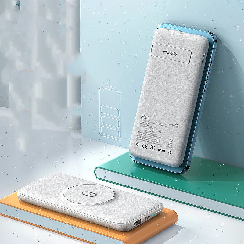 Maiduo mint green MagSafe magnetic wireless power bank with back clip, shown next to an iPhone.