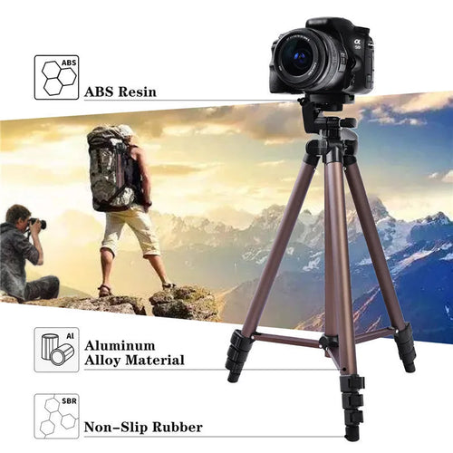Aluminium camera tripod extended to 1.3m with hydraulic head, mobile phone holder, and Bluetooth remote on a table.