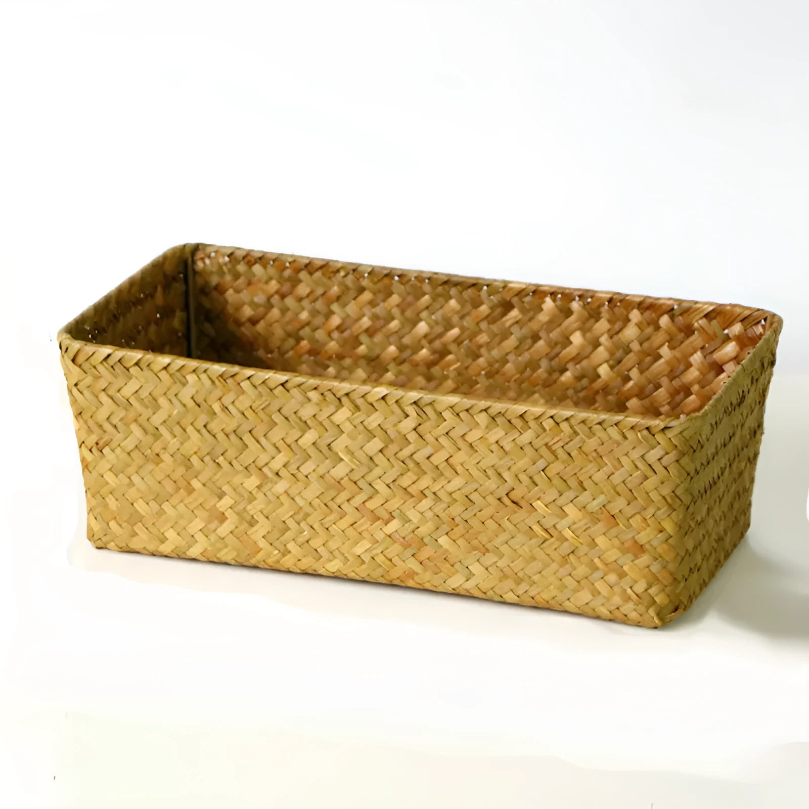 Brown woven straw desk storage box with lid shown on wooden surface