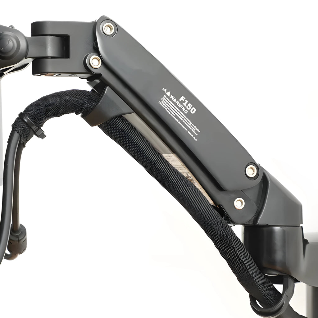Black wall-mounted monitor stand with telescopic and rotating arm on a wall