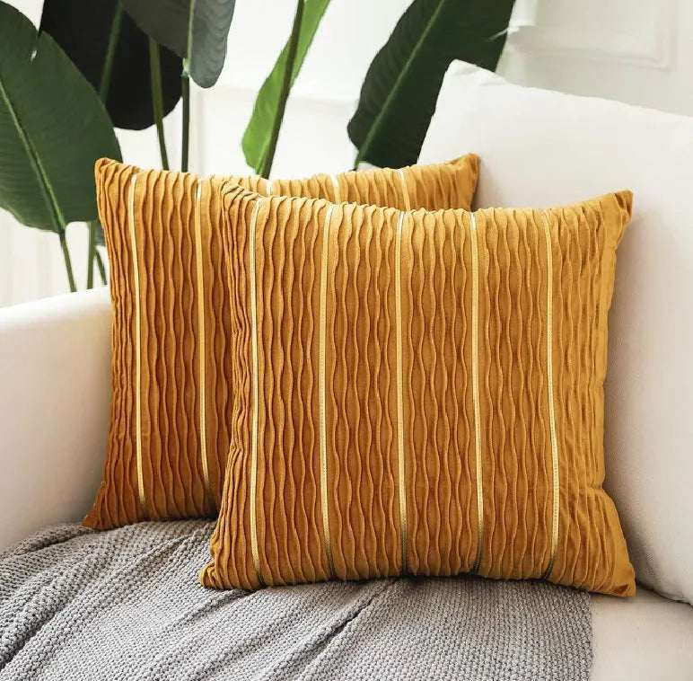Square striped velvet pillow cover for sofa in multiple colour options on a grey background.