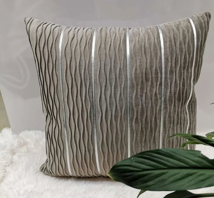 Square striped velvet pillow cover for sofa in multiple colour options on a grey background.
