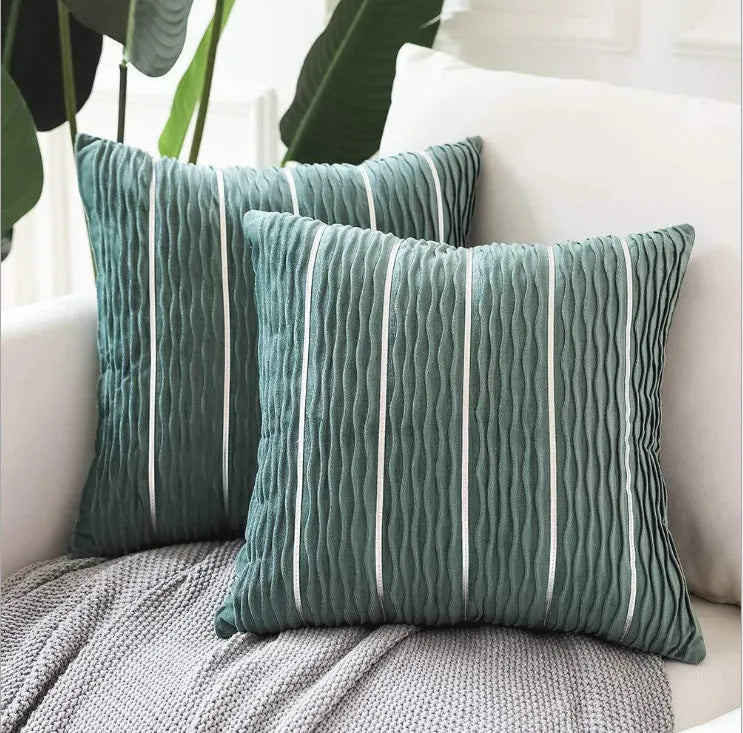Square striped velvet pillow cover for sofa in multiple colour options on a grey background.