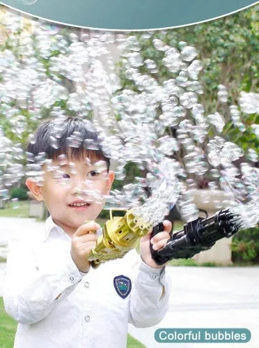Kids pink bubble machine gun toy with leaf blower design on green grass