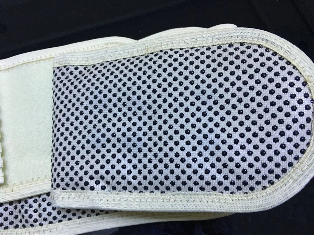 Black self-heating magnetic waist support belt for lumbar muscle strain, shown on a neutral background.