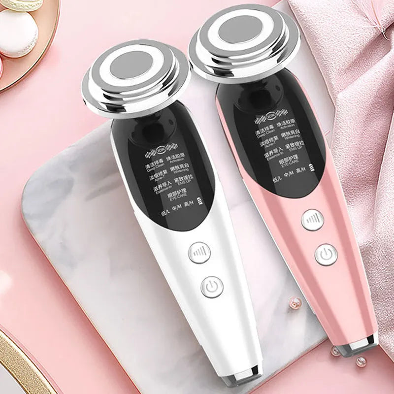 Seven-mode EMS iontophoresis beauty instrument in pink with USB charging cable