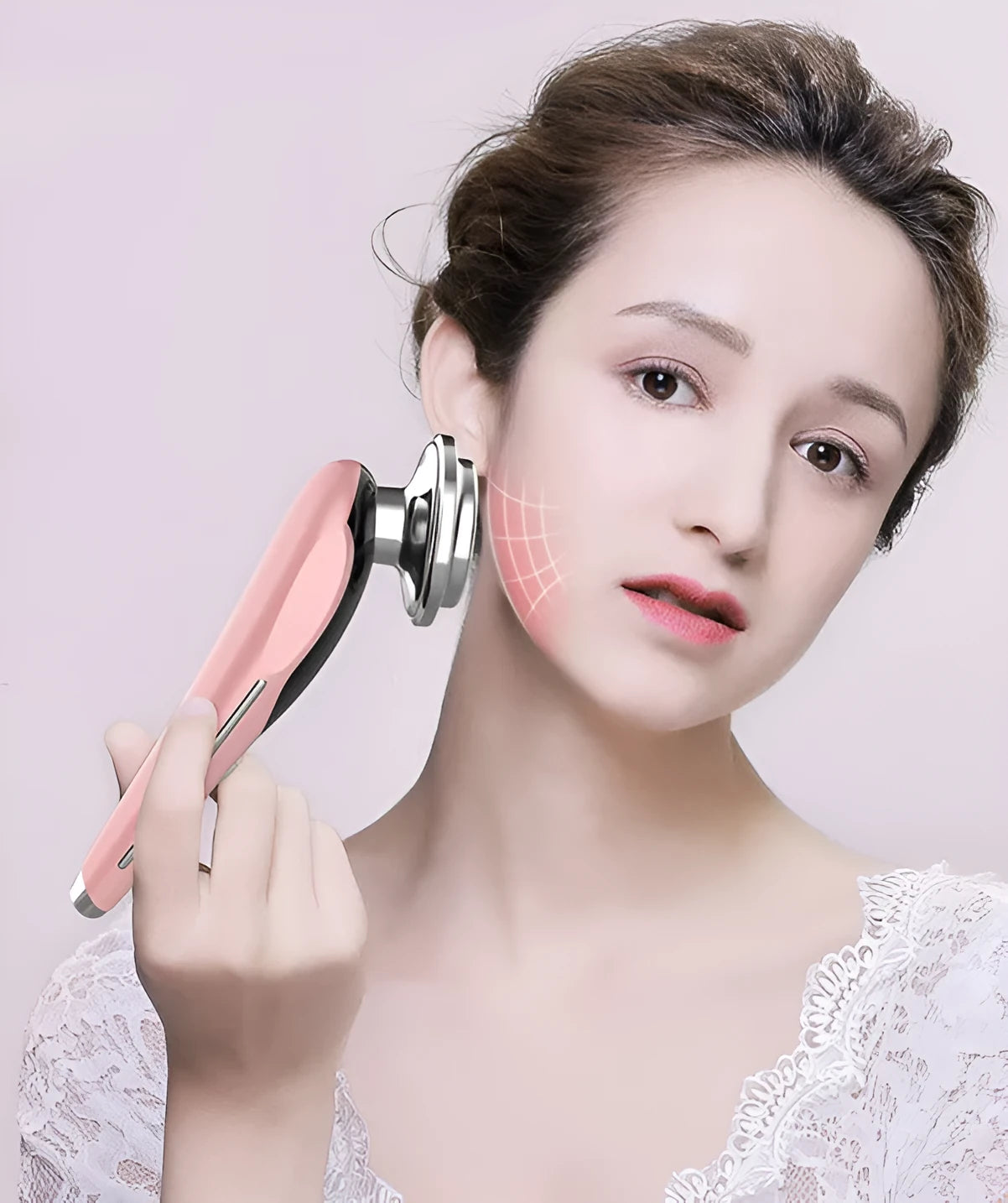Seven-mode EMS iontophoresis beauty instrument in pink with USB charging cable