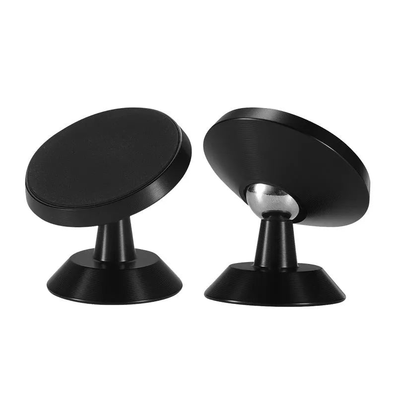 Universal magnetic car phone holder in black, silver, and gold colours on a car dashboard.