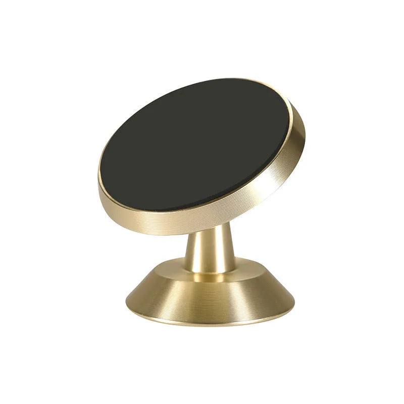 Universal magnetic car phone holder in black, silver, and gold colours on a car dashboard.