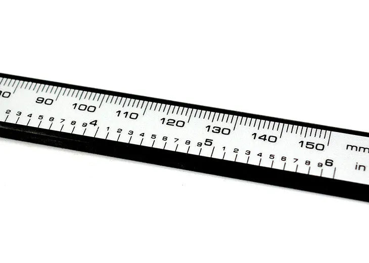 Digital vernier caliper with metal casing, stainless steel guide track, and LCD display showing measurement