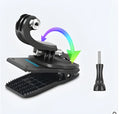 Gopro backpack clip with 360-degree rotating head, made from black ABS plastic and aluminium alloy, shown attached to a strap.