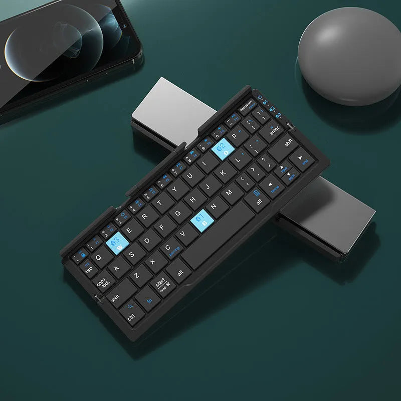 Silver white folding Bluetooth keyboard shown open with stand supporting a smartphone