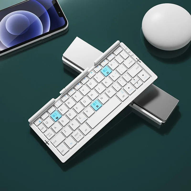 Silver white folding Bluetooth keyboard shown open with stand supporting a smartphone