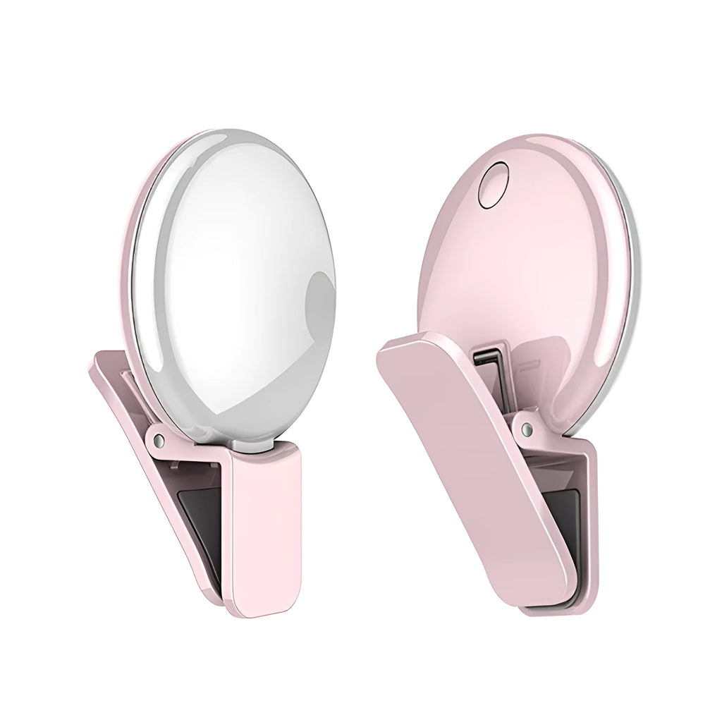 Round USB rechargeable LED fill light attached to a mobile phone for selfies.