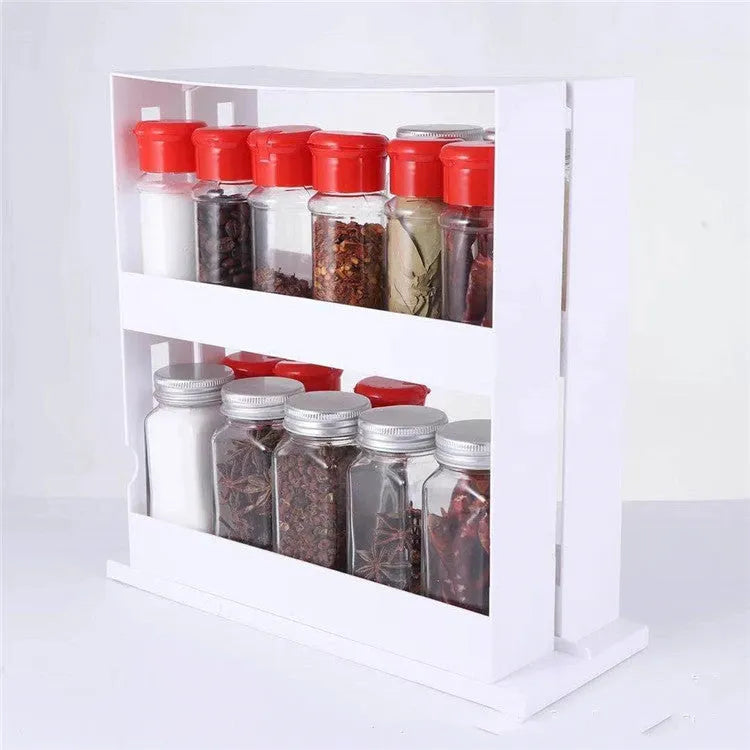 White double rotating 2-tier plastic spice rack on countertop with jars