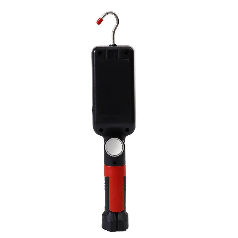 Red portable COB rechargeable work lamp with magnetic hook on a metal surface.