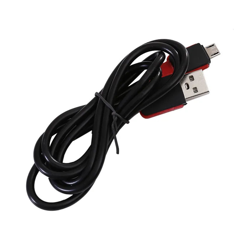 Red portable COB rechargeable work lamp with magnetic hook on a metal surface.