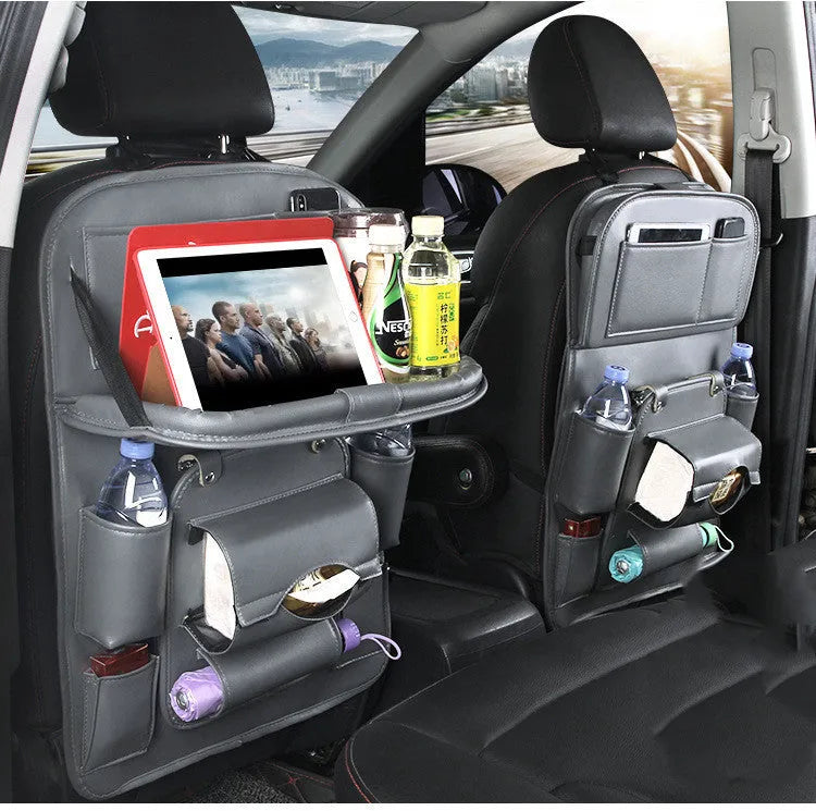 Black PU leather car seat back storage organiser with multiple pockets, attached behind a car headrest.