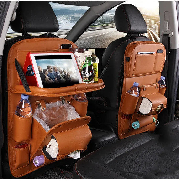 Black PU leather car seat back storage organiser with multiple pockets, attached behind a car headrest.