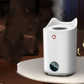 Coral Pink and Glacier White USB double spray humidifier with three mist outlets on a table.